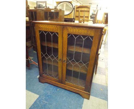 A Glazed Oak Three Shelf Bookcase.