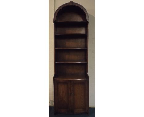 An Oak Arched Top Four Shelf Open Bookcase with Cupboard Base.