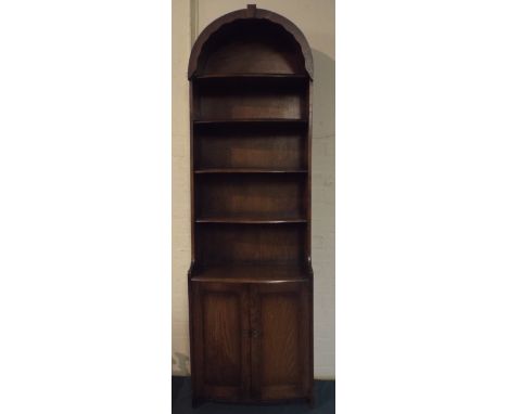 An Oak Arched Top Four Shelf Open Bookcase with Cupboard Base.