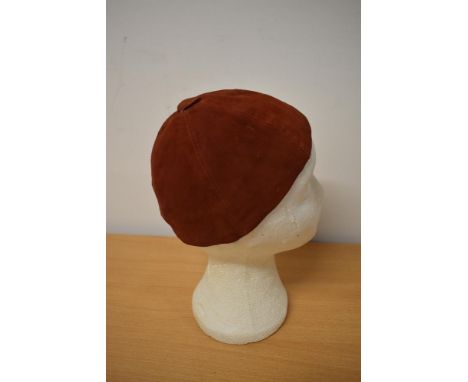 A 1930s red soft Nubuck/ suede skull cap, 'A Jacoll hat, made in England'.