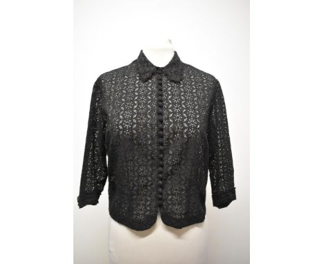 A 1930s black blouse, having twenty two little self covered buttons to the front and 3/4 length sleeves.