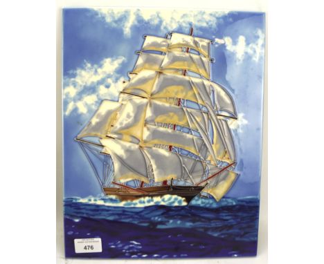 A contemporary tube lined ceramic wall plaque in the Moorcroft style, depicting a masted boat at sea, L28cm x H35cm