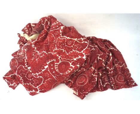 A pair of lined red and white curtains, the cotton printed in red with dense leaves and flowerheads, 220cm long x 187 cm  Con