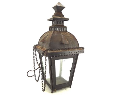 A hanging metal garden lantern, of pagoda form with glazed doors, suspended from chains and hook, approx. H67cm exc chain 