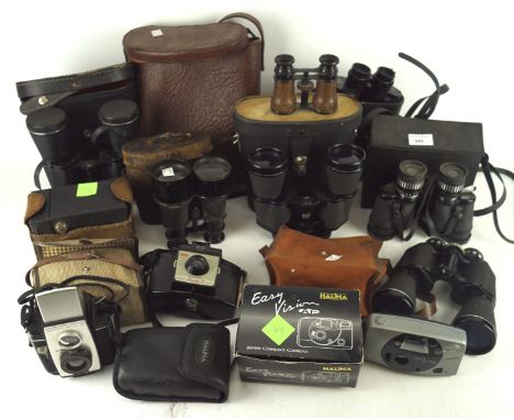 A collection of vintage cameras and binoculars, including a pair of Prinz 8x40, Miranda 16 x 50, Kodak 'Brownie Reflex 20' an