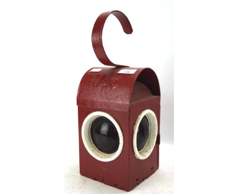 A vintage mid-century Mac hand held lantern, painted in red and white, with three red lights, 38 cm high 