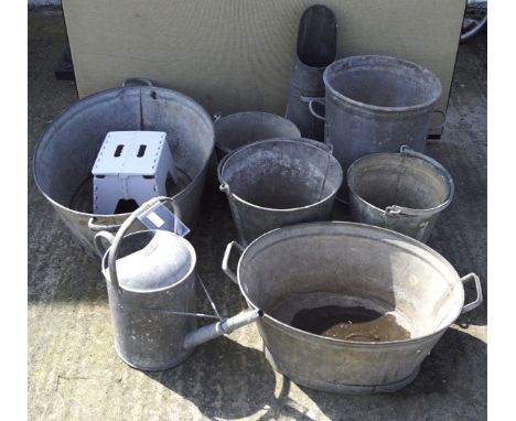 A selection of galvanized metal wares, including buckets, flower tubbs, a watering can and a pitcher