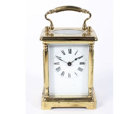 A brass carriage clock, the enamelled dial with Roman numerals denoting hours, H11.5cm