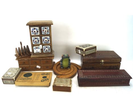 An assortment of wooden collectables, including: inlaid boxs in sizes, a spice box with ceramic drawers, a toast rack, a mini