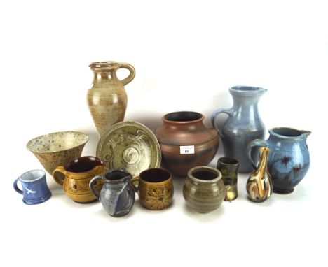 A collection of 20th century Studio pottery of various sizes and designs, including a large saltglazed stoneware pitcher, a c