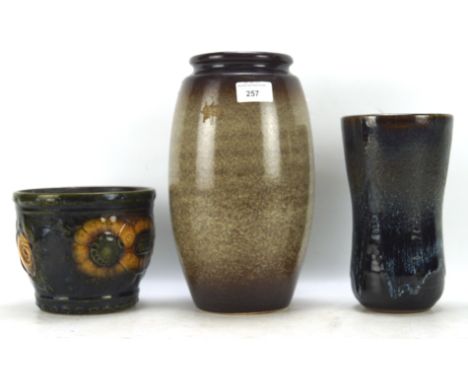 Three ceramic vases, one West German model number 887-14 13cm high, a studio vase 21cm high and one other stamped 0201028 28c