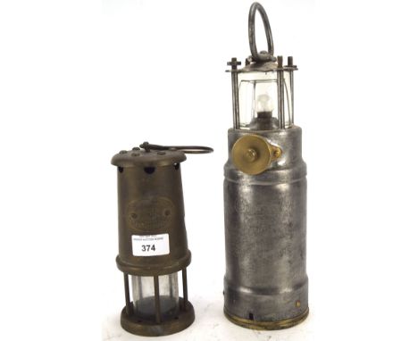 Two lanterns, one a miner's lamp marked for Hookley Lamp &amp; Limelight Co., Colliery no. 8721, the other marked Oldham Lant