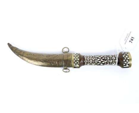 A Middle Eastern style knife, with engraved steel blade, inlaid handle and brass scabbard