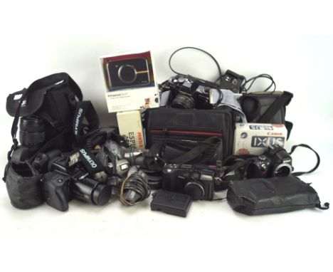 Large collection of vintage cameras and related equipment, including: an Olympus Camedia E-20p 5.0 megapixel, a Praktica BMS 