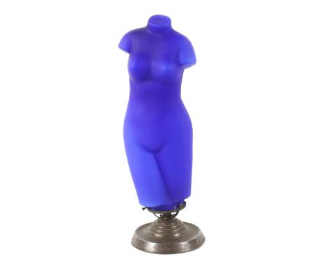 A Continental blue glass lamp in the form of a naked female torso, on a round base approx 36cm high overall