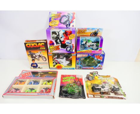 Motorcycle Toys - A collection of vintage boxed / carded motorcycle toys including Police Motorbike, Paris-Peking Rally Bike 
