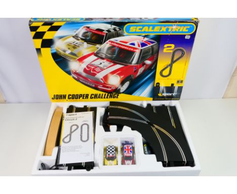 Scalextric - A boxed Scalextric C1112 'John Cooper Challenge' set. The set appears to be in Mint condition. The box itself ha