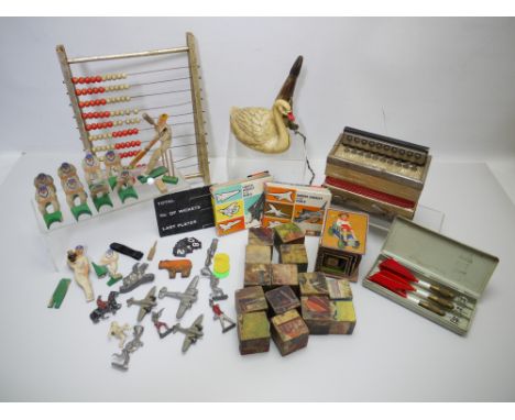 Wooden Toys - Unicorn Products. A group of toys including a cricket game, a German made Accordeon, a set of darts, wooden blo