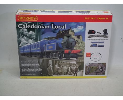Hornby - A boxed Hornby R1016 OO gauge 'Caledonian Local' electric train set. The set appears to be in Mint condition with ma