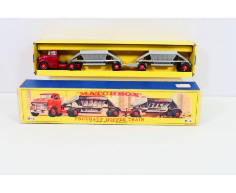 Matchbox - A boxed Matchbox Major M4 Fruehauf Hopper Train. The model with maroon tractor, two silver trailers black plastic 