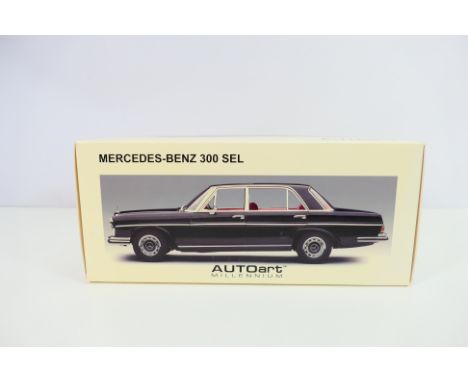 Autoart - A boxed 1/18 scale 1970 Mercedes Benz 300 SEL 6.9 in black # 76140. The model is lightly dusty from display and app