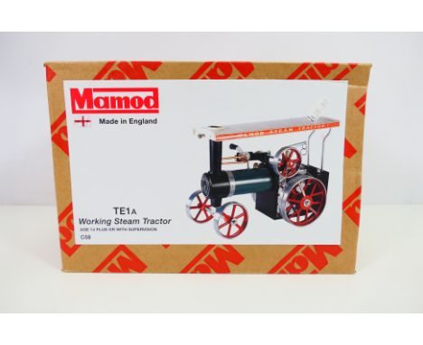 Mamod - A boxed Mamod C58 TE1A steam tractor. The model appears to be in Mint condition, and gives the impression it has neve