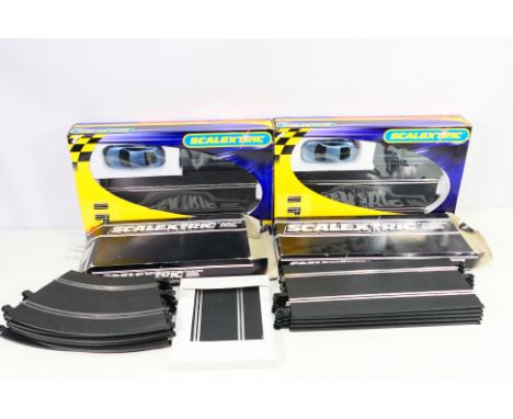 Scalextric - A boxed / partially boxed group of vintage and modern Scalextric track and track accessories. Lot includes Scale