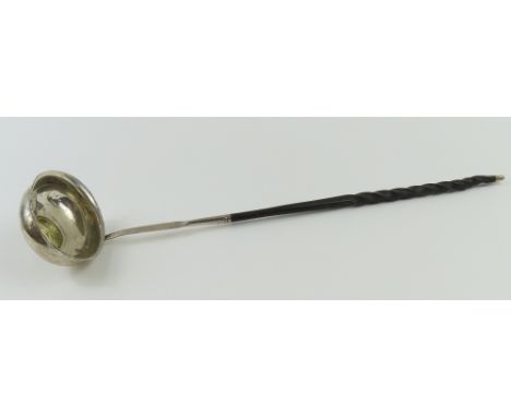 A silver toddy ladle with twisted handle and coin of George II set into bowl. No hallmark, but scribed into the back of the n