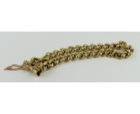 A thick figure of eight type link bracelet, each link marked '18' with a crown, possibly originally part of a longer chain, w