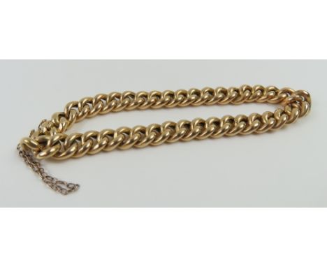 A rounded curb link bracelet, possibly originally part of a watch chain, 18cm long, acid tests as approximately 18-22ct gold,