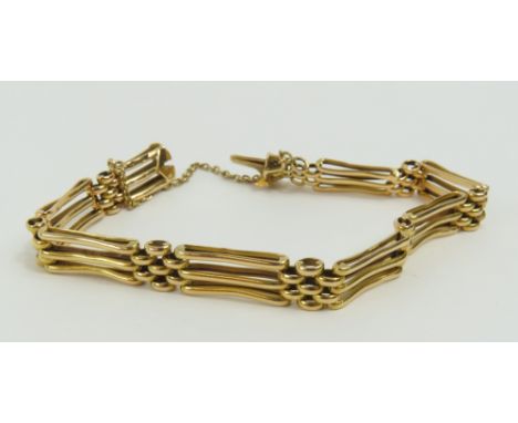A 19th or early 20th century three bar gate bracelet, with small brick links between, marked '18ct' with an anchor and star, 