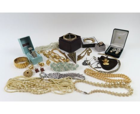 A vintage white and green paste stone torque bangle, cased; a Stroili wide hinged bangle; together with various costume neckl