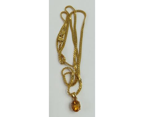 A flat fancy link chain, with a double S shaped clasp, bears control marks, 60cm long, with a small orange stone pendant, the