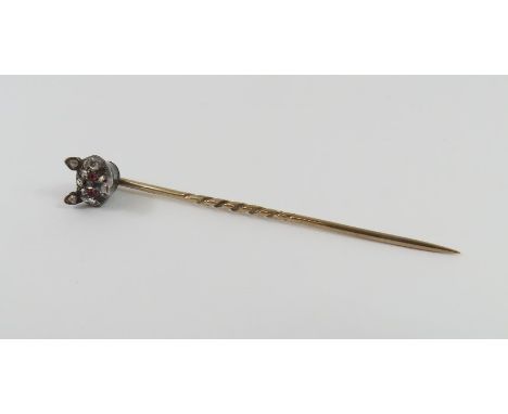 A Victorian fox mask stick pin, the fox mask set with rose cut diamonds and a pair of cabochon cut rubies for eyes, the pin a