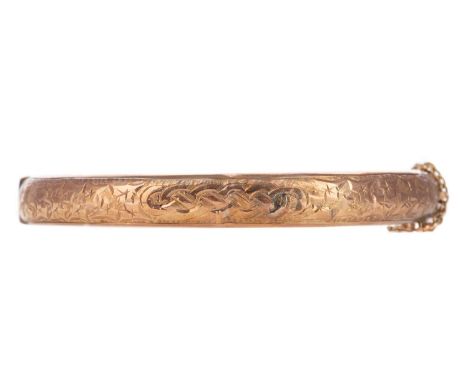 GOLD ENGRAVED BANGLE,indistinctly marked, 7.9g