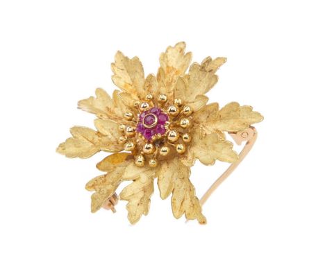 RUBY FLOWER BROOCH,set centrally with round rubies, in eighteen carat gold, 8gGenerally worn.&nbsp;Catch in working order.&nb
