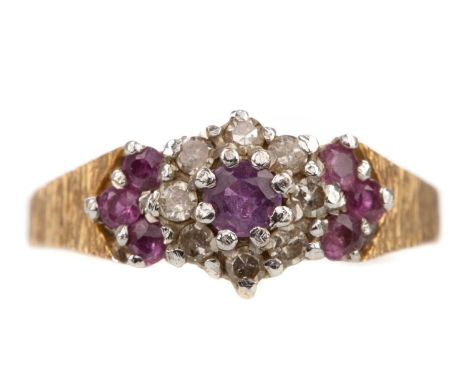 RUBY AND DIAMOND CLUSTER RING,set with round rubies and diamonds, to a textured shank, in nine carat gold, size L 1/2, 2.9g