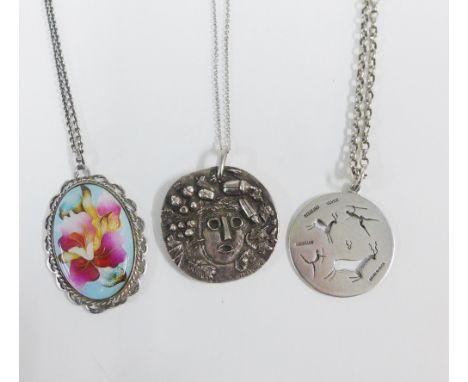 Plique a jour enamel pendant in a silver frame, Sterling silver South Africa pendant and another, all on chains (3) 