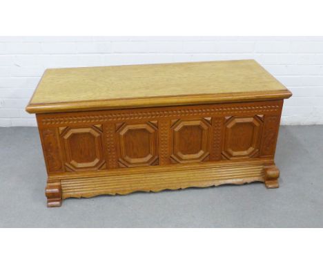 Contemporary light oak blanket box with carved front panel and metals side handles, 54 x 122 x 62cm 