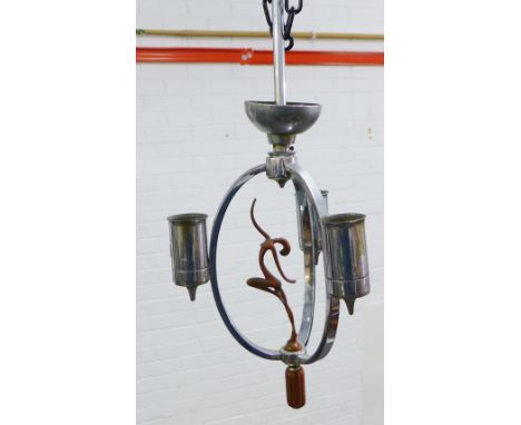 An Art Deco chromed metal ceiling light centred by a dancing female nude figure