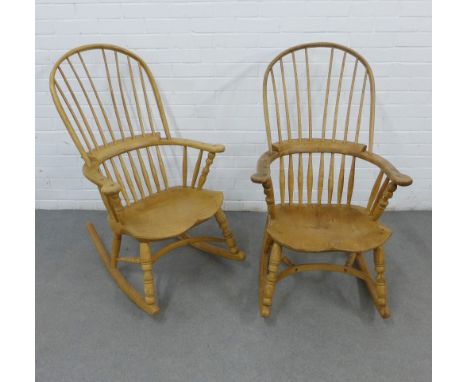 Two Windsor style pine rocking chairs with hoop comb backs, solid saddle seats and sleigh style rockers, 104 x 64cm (2) 