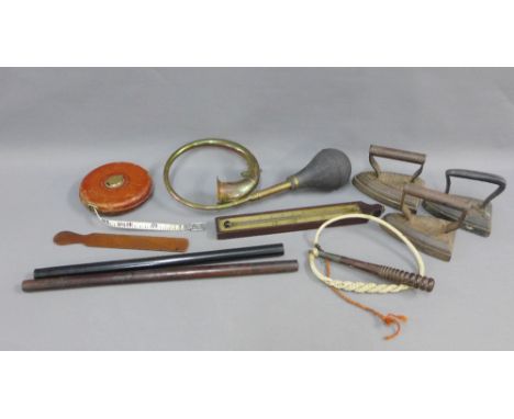 Vintage items to include three flat irons, leather tape measure, car horn, page turner, small cosh and a wall thermometer, et
