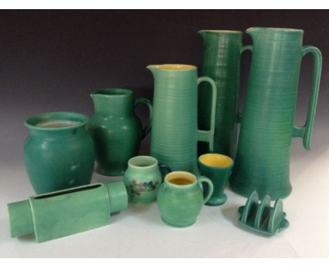 Bretby Kitchen Ware - a mint green jug, 32.5cm high, impressed marks, c. 1930; another, smaller, 32cm high, impressed marks, 