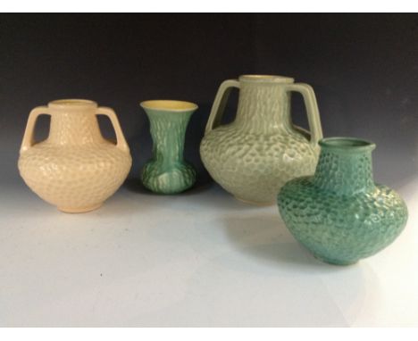 A Bretby two-handled amphora vase, glazed in light green, moulded in low relief, 25cm high, impressed marks; a similar bottle