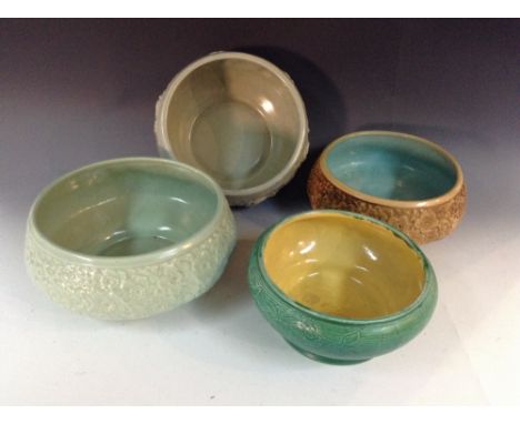 A Bretby circular eggshell bowl, moulded in low relief with blossoming pansies, 23cm diam, impressed marks; another similar, 