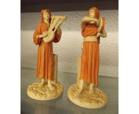 PAIR OF ROYAL WORCESTER EGYPTIAN MUSICIAN FIGURES PUCE MARK AND NUMBERS 1084