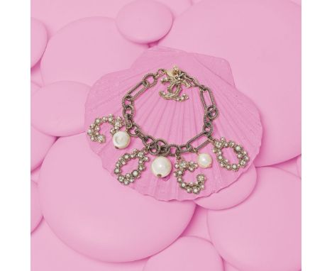 Pale Gold Tone Coco Charm Bracelet,Chanel, Spring 2014,Chain bracelet hung with alphabet charms with simulated pearl details,