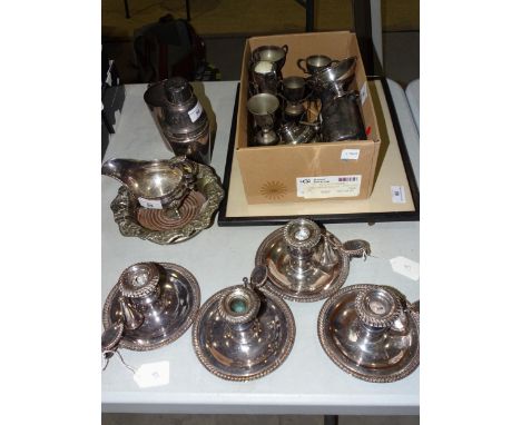 A set of four plated chambersticks with gadrooned rims and snuffers, 8cm high, a plated cocktail shaker, other plated ware an
