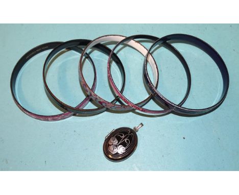 A "Michaela Frey Team" enamelled bangle, four others, similar and a Michaela Frey locket. 