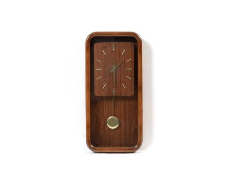 Deko: A mid-Century teak framed wall clock of rectangular form, the teak dial with baton numerals, cased in glass, 31 x 61cm 